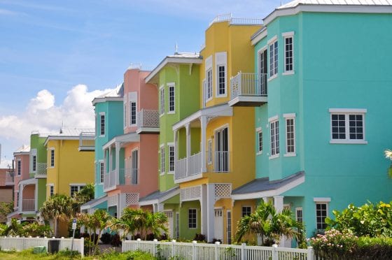 FL_Commercial_exterior_colors_pink_blue_yellow_florida_palm_tree_condo
